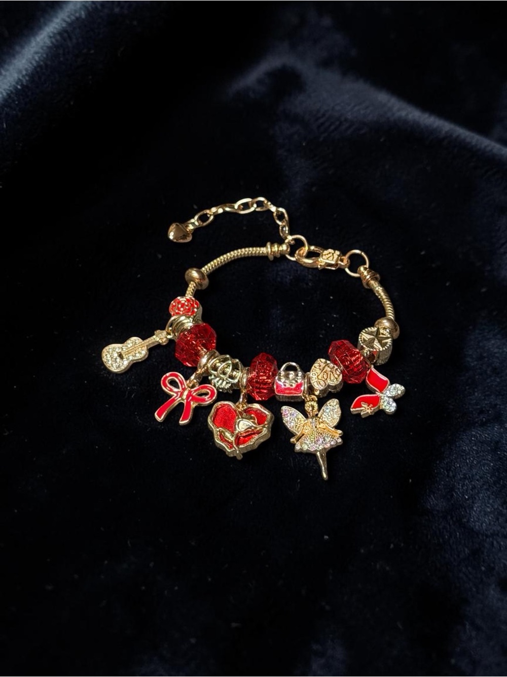 Gold Tone Charm Bracelet with Red Enamel Accents
